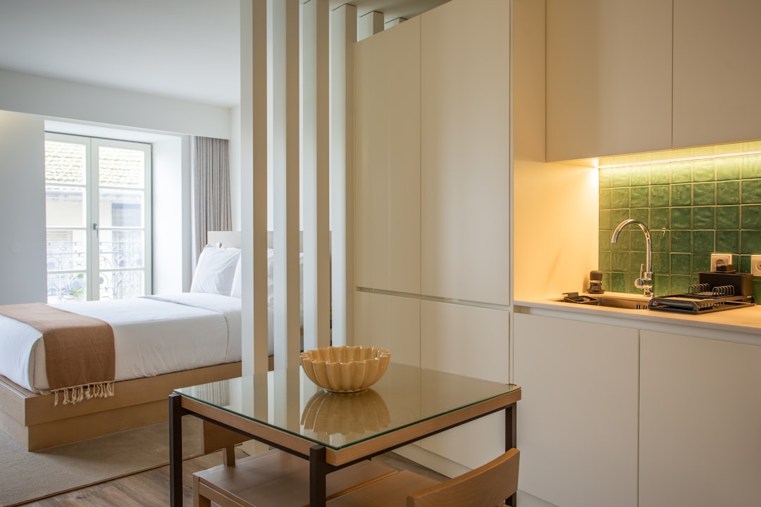 gallery-01 a-room-with-a-bed-and-a-table-with-a-bowl-on-it-deuvqnbwruw