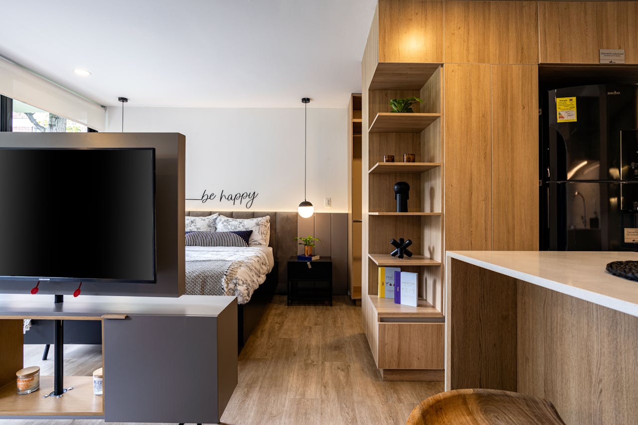 gallery-04 Cozy and stylish studio apartment interior design in Bogotá with wooden accents.
