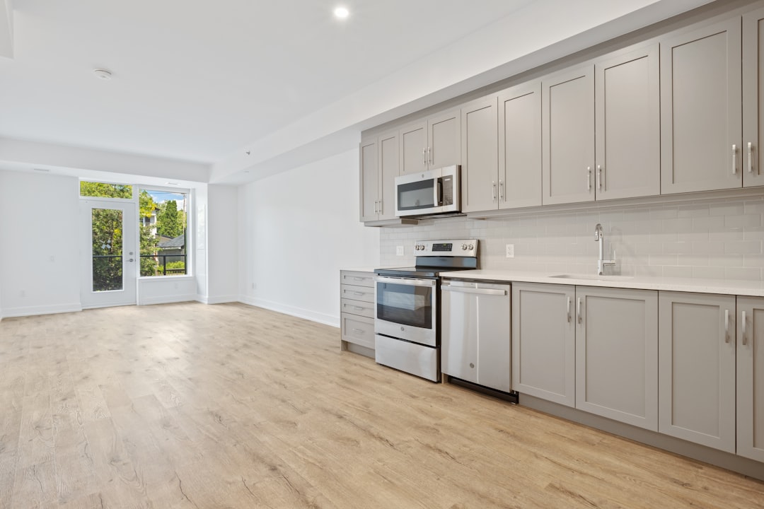 about-img white-wooden-kitchen-cabinet-near-white-wall-1bqaggpwi7e